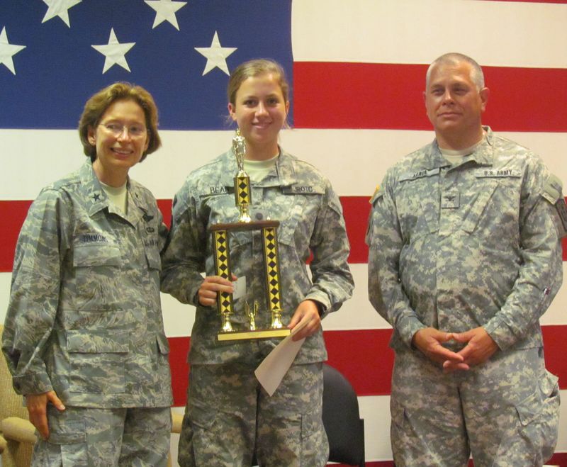 Cadet 2nd Lt. Kaycee Bean of Laurel received the highest distinction of First Honor Cadet at the JROTC Camp Vigilance 2012. She was also named Best Squad Drill Commander and was a member of the winning land navigation squad. She receives her award from Brig. Gen. Carol Timmons and U.S. Army (Ret.) Col. Joseph Arata. SOURCE SUBMITTED